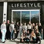 R.I.C. graduate intern cohort standing outside Lifestyle Studio during supervision program outing