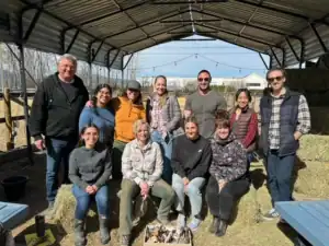R.I.C. supervision cohort of graduate counselling interns gathered outdoors during a spring training retreat
