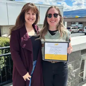 Laura MacLean receiving her Graduate Student Internship Award with her R.I.C. supervisor.