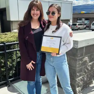 Nina Bell Peters receiving her Graduate Student Internship Award with an R.I.C. supervisor.